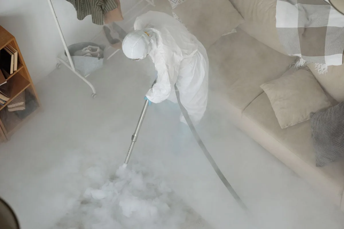 Biohazard cleanup technician in protective equipment, Pelham Manor, NY